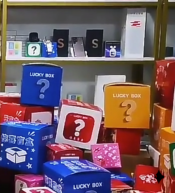 Retail shelf stacked with lucky box cartons in blue, red and yellow